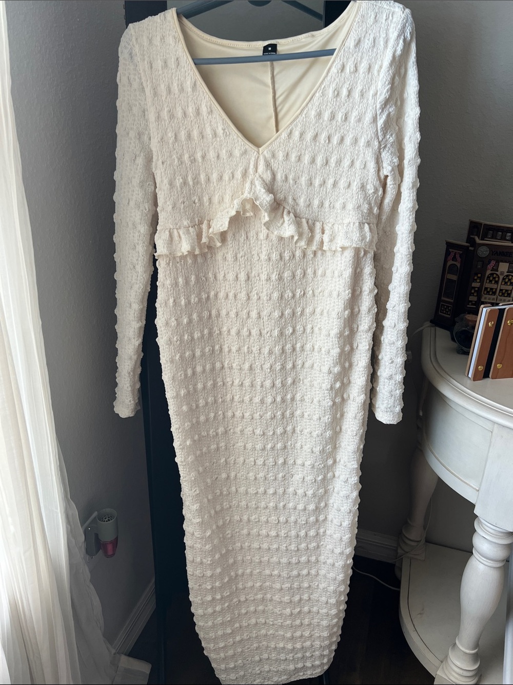 Cream Textured Knit V-Neck Long Sleeve Maternity Dress with Ruffle Detail.
